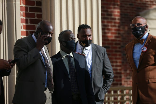 Marcus Arbery stands with his attorneys outside the Glynn County Courthouse on Monday October 18, 2021.