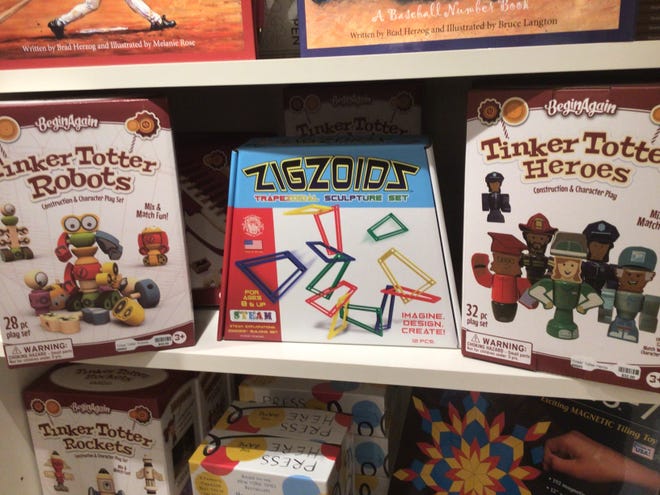 Zigzoids, center, $19.95, lock into place to create architectural marvels. On each side, Tinker Totter pieces, $17.95, that create custom characters. At The Baker Museum gift shop.