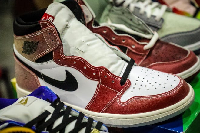 John Green of Washington DC says he hopes to receive $3000 for this pair of Trophy Room Jordan 1s during the Sneaker Exit trade show at the Palm Beach Convention Center Sunday, January 16, 2022.