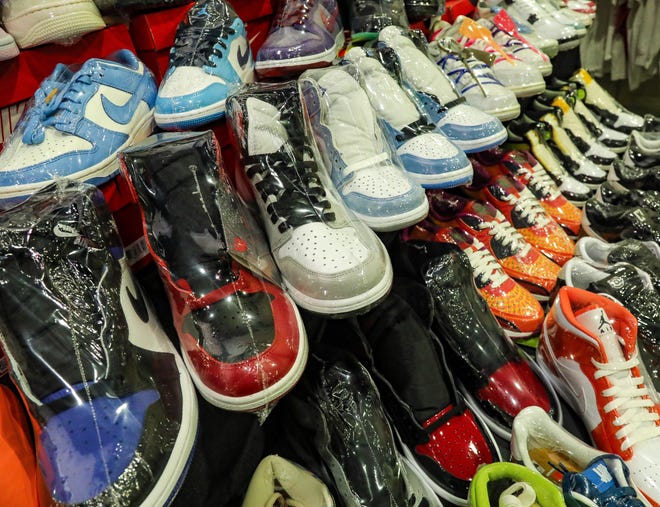 Sneakers wrapped in plastic are neatly aligned and ready for sale at the Ross Kicks booth during the Sneaker Exit trade show at the Palm Beach Convention Center Sunday, January 16, 2022.