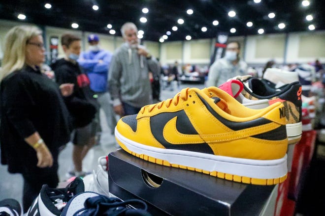 A Yellow Nike Dunk Golden Rod is for sale at the Sole.Fixx booth during the Sneaker Exit trade show at the Palm Beach Convention Center Sunday, January 16, 2022.