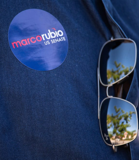 A Marco Rubio campaign sticker is seen on the shirt of a guest at an event for the Florida Senator's re-election campaign held at the Sims House on Thursday, October 27, 2022, in Jupiter, FL.