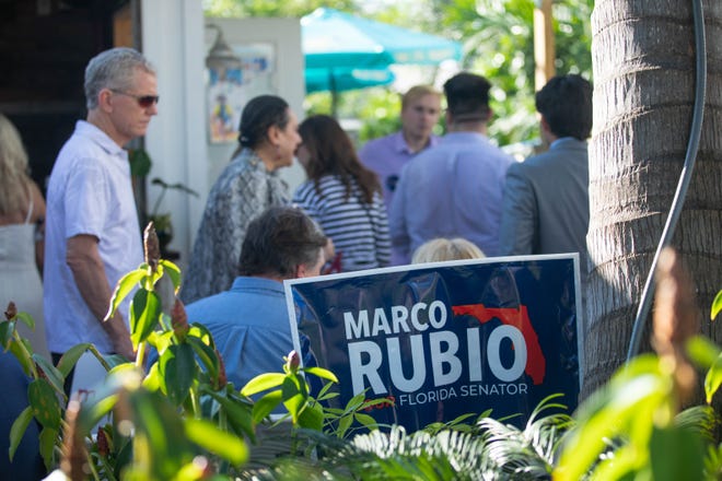 A crowd of Marco Rubio supporters mingle before the start of an event for the Florida Senator's re-election campaign held at the Sims House on Thursday, October 27, 2022, in Jupiter, FL.