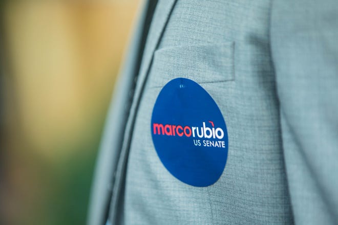 A Marco Rubio supporter is seen wearing a campaign sticker during an event for Marco Rubio's re-election campaign held at the Sims House on Thursday, October 27, 2022, in Jupiter, FL.