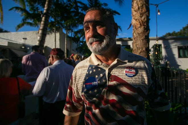 Willy Guardiola, a Republic community activist from Palm Beach Gardens, is seen wearing a Marco Rubio sticker and a Ron DeSantis button during an event for Senator Marco Rubio's re-election campaign held at the Sims House on Thursday, October 27, 2022, in Jupiter, FL.