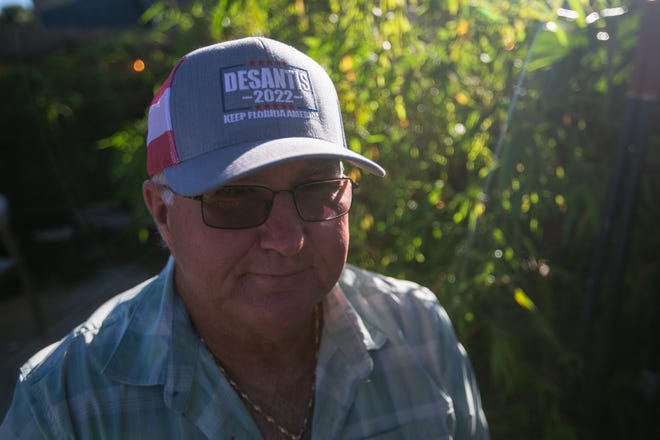 Tim Brown, a resident of Jupiter, wears a "DeSantis 2022" hat during an event for Senator Marco Rubio's re-election campaign held at the Sims House on Thursday, October 27, 2022, in Jupiter, FL.