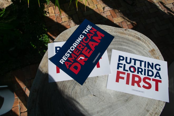 Campaign signs are seen on a table during an event for Senator Marco Rubio's re-election campaign held at the Sims House on Thursday, October 27, 2022, in Jupiter, FL.